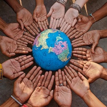 Many hands around a globe